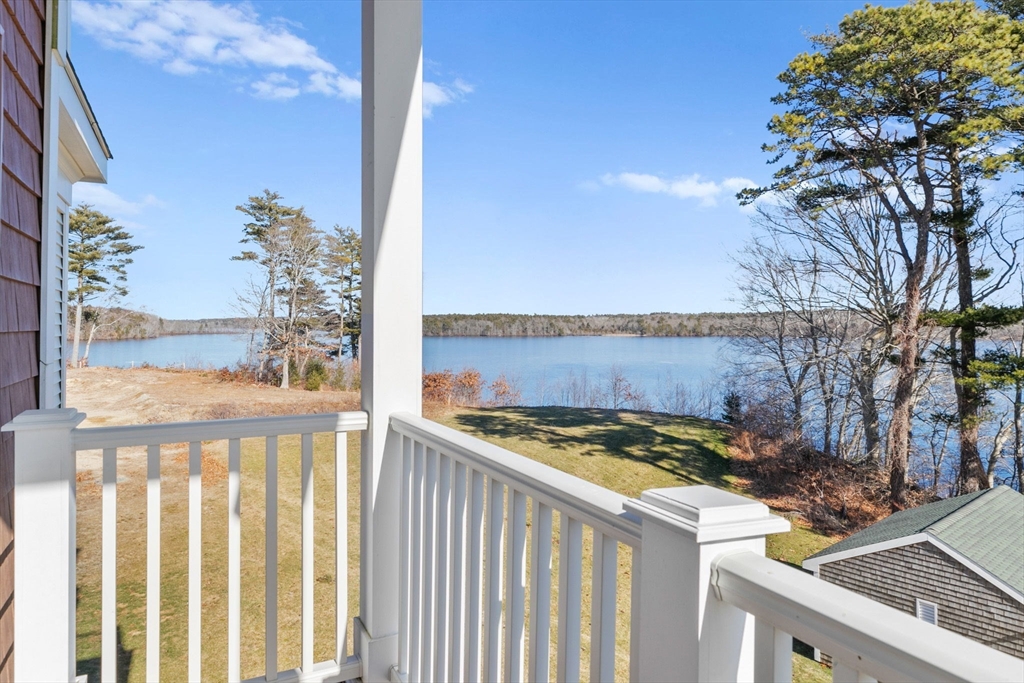 57 Long Point Road, Unit 310 Lakeville, MA 02347 - Photo 12 of 21 a view of a chairs and table in the balcony