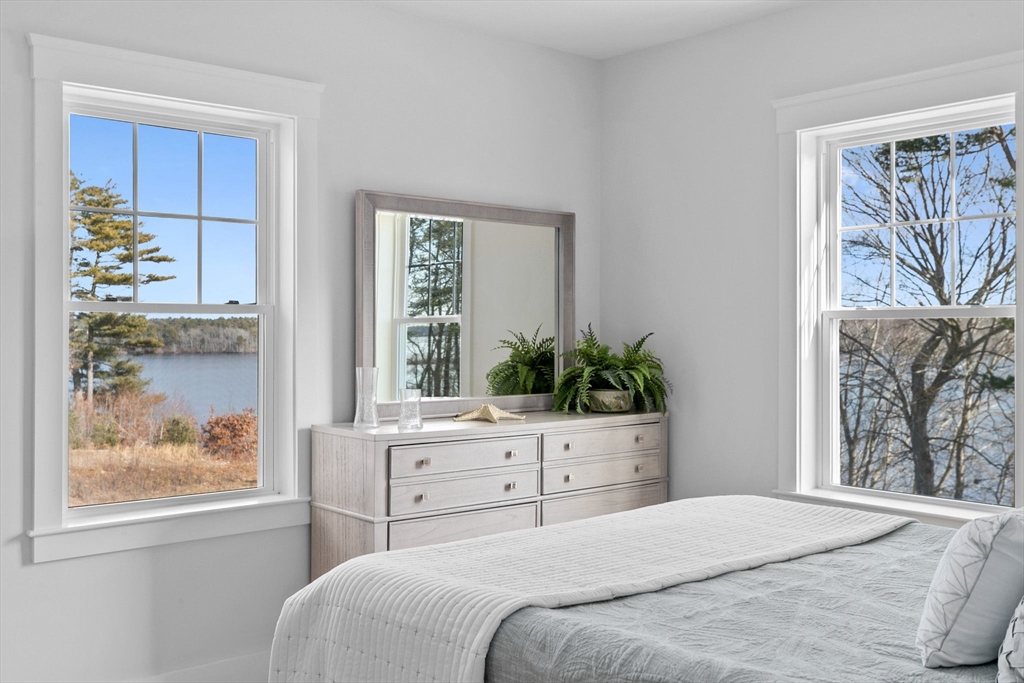 57 Long Point Road, Unit 310 Lakeville, MA 02347 - Photo 13 of 21 a bedroom with a large bed and a window