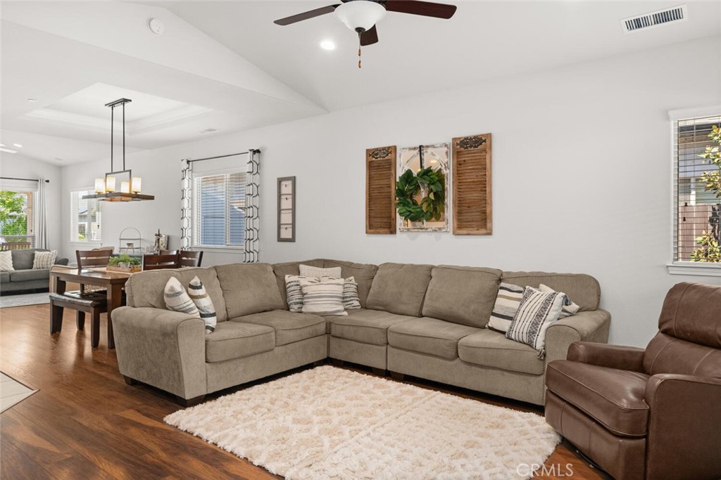 2816 Levi Lane Chico, CA 95973 - Photo 13 of 35 a living room with furniture kitchen view and a chandelier