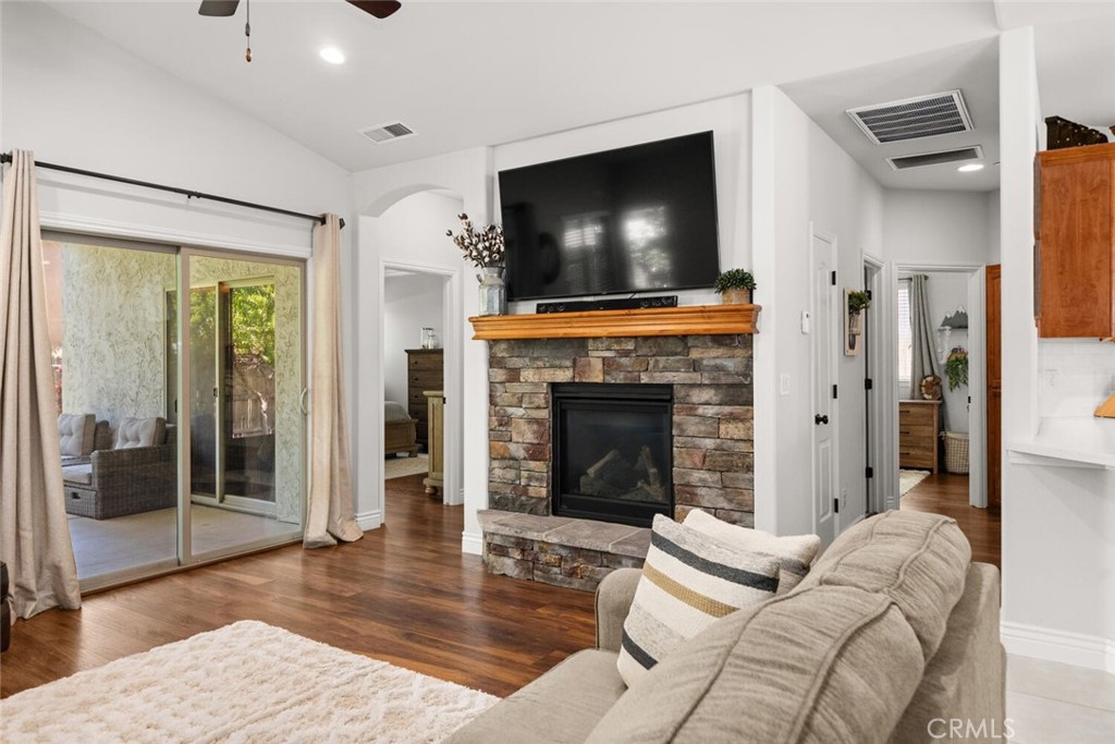 2816 Levi Lane Chico, CA 95973 - Photo 16 of 35 a living room with furniture a flat screen tv and a fireplace
