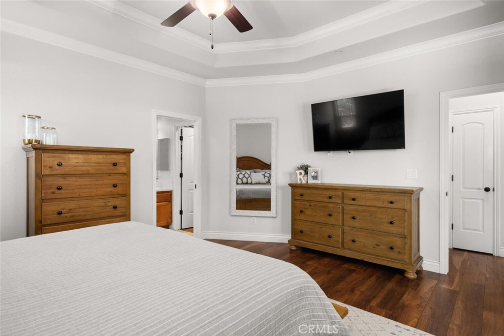 2816 Levi Lane Chico, CA 95973 - Photo 18 of 35 a bedroom with a bed and a flat screen tv