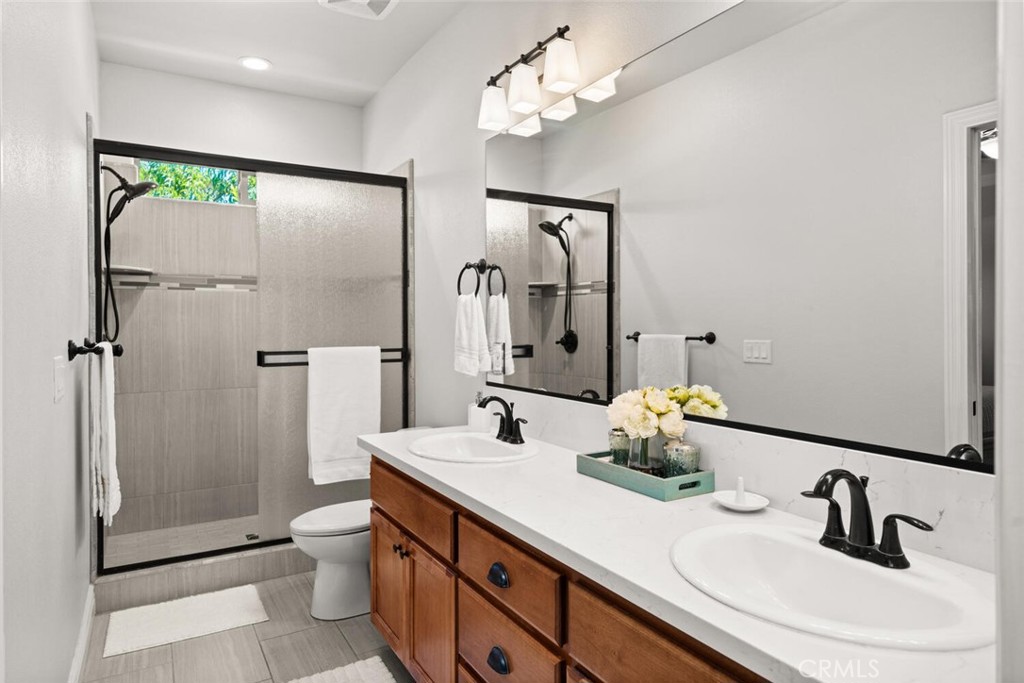 2816 Levi Lane Chico, CA 95973 - Photo 19 of 35 a bathroom with a double vanity sink toilet and shower