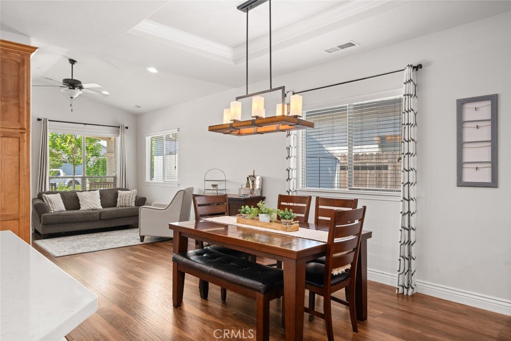 2816 Levi Lane Chico, CA 95973 - Photo 7 of 35 a view of a dining room with furniture window and wooden floor