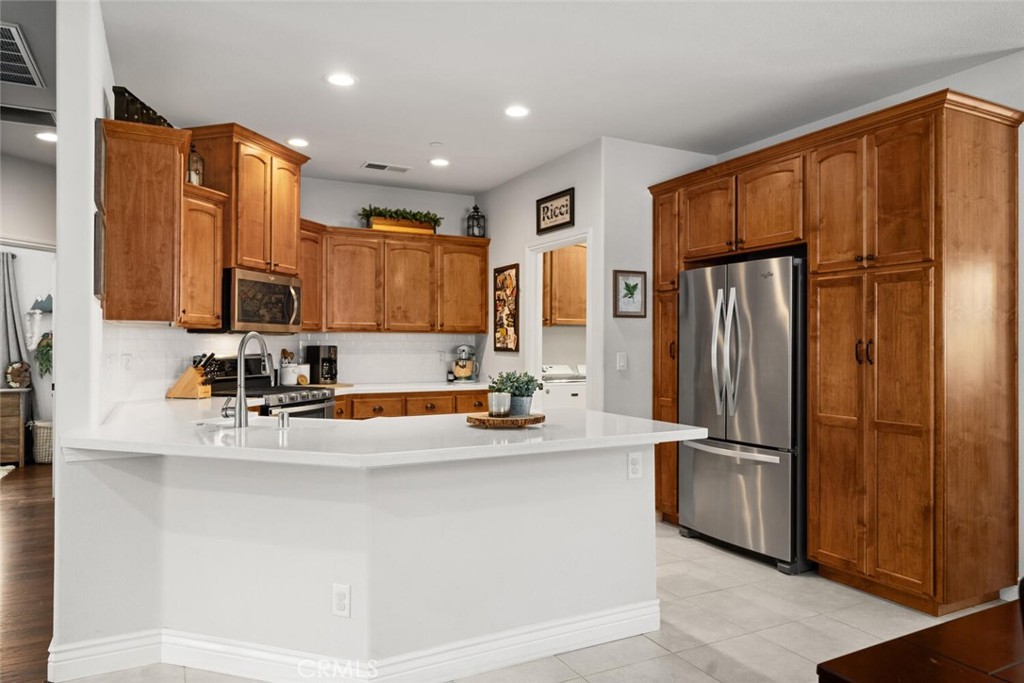 2816 Levi Lane Chico, CA 95973 - Photo 8 of 35 a kitchen with stainless steel appliances granite countertop a refrigerator and a sink