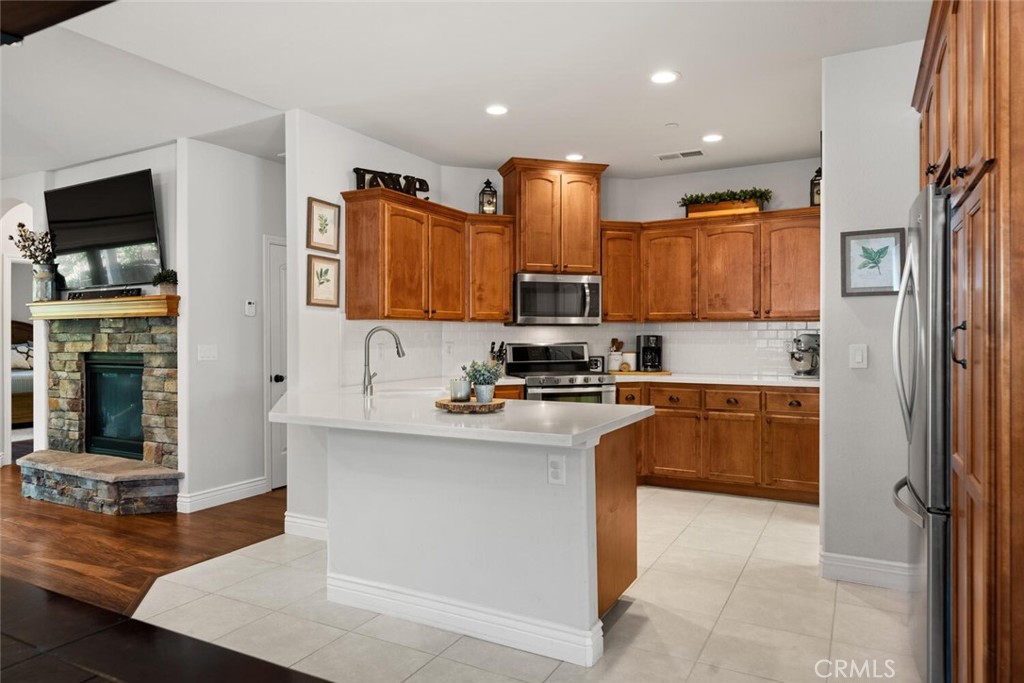 2816 Levi Lane Chico, CA 95973 - Photo 10 of 35 a kitchen with stainless steel appliances granite countertop a stove top oven a sink and a refrigerator