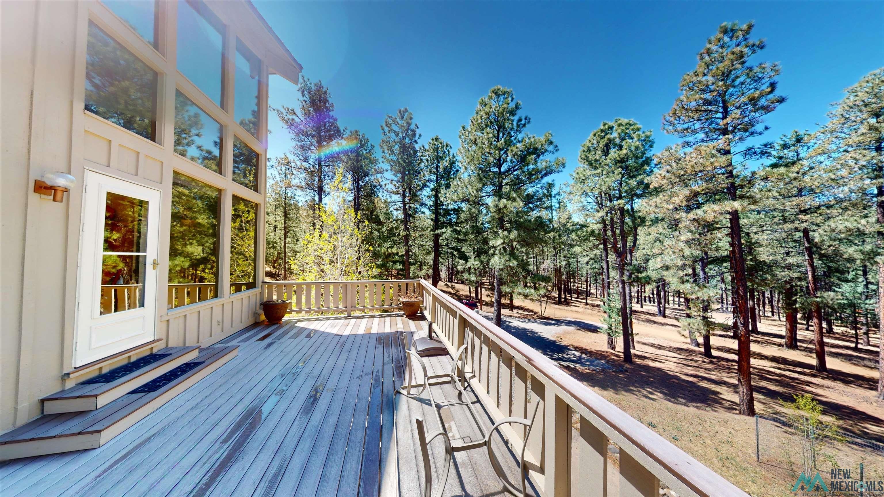 39 Alta Vista Rociada, NM 87742 - Photo 46 of 54 Expansive outdoor deck with a wooden railing system