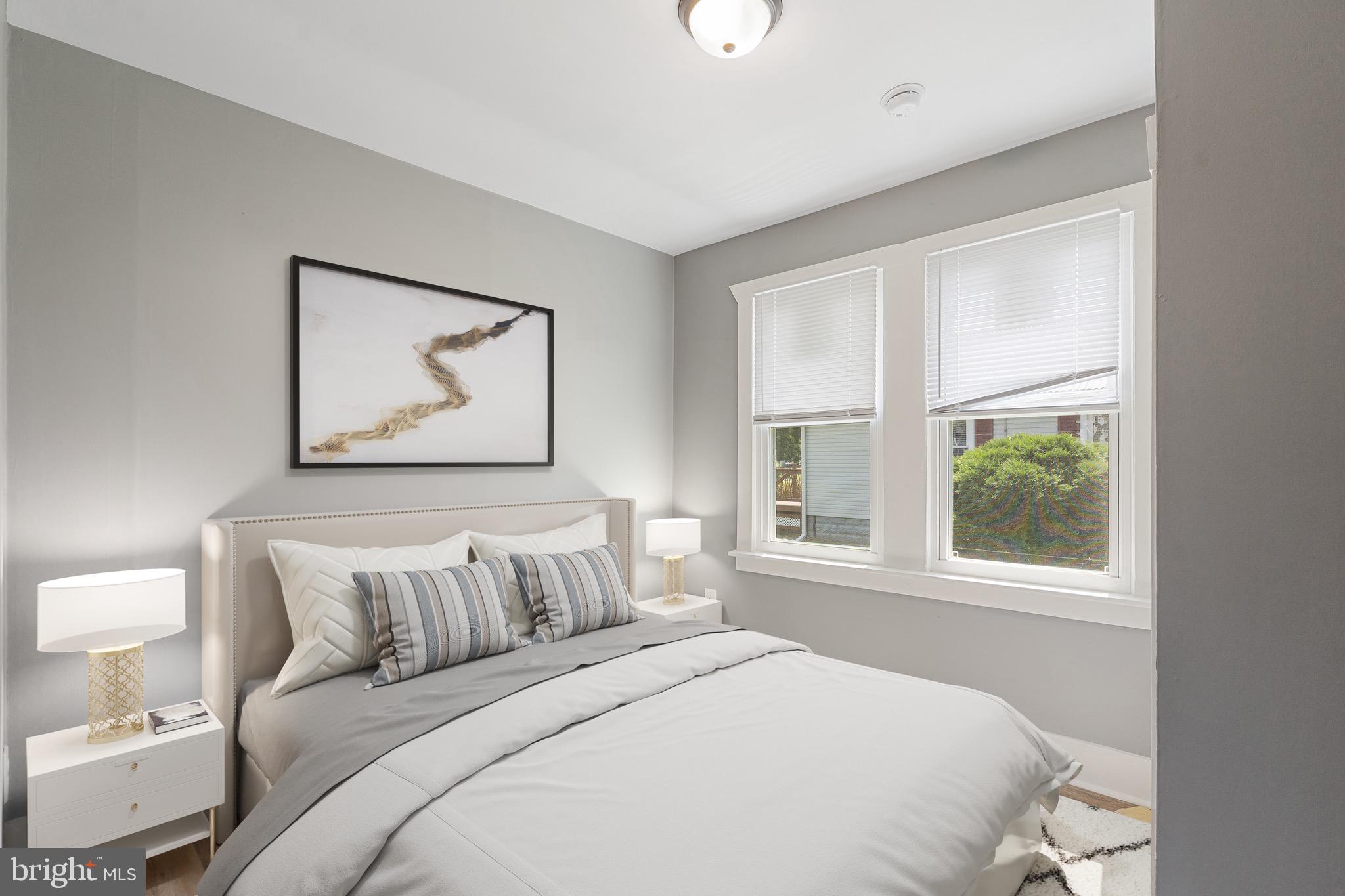 109 Georgia Road Pennsville, NJ 08070 - Photo 11 of 40 a bedroom with a bed and a painting on the wall
