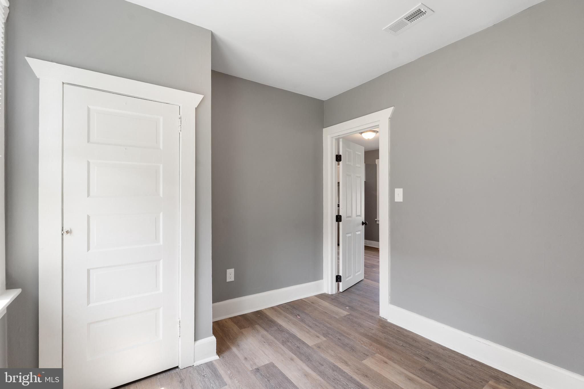 109 Georgia Road Pennsville, NJ 08070 - Photo 13 of 40 an empty room with wooden floor & closet door