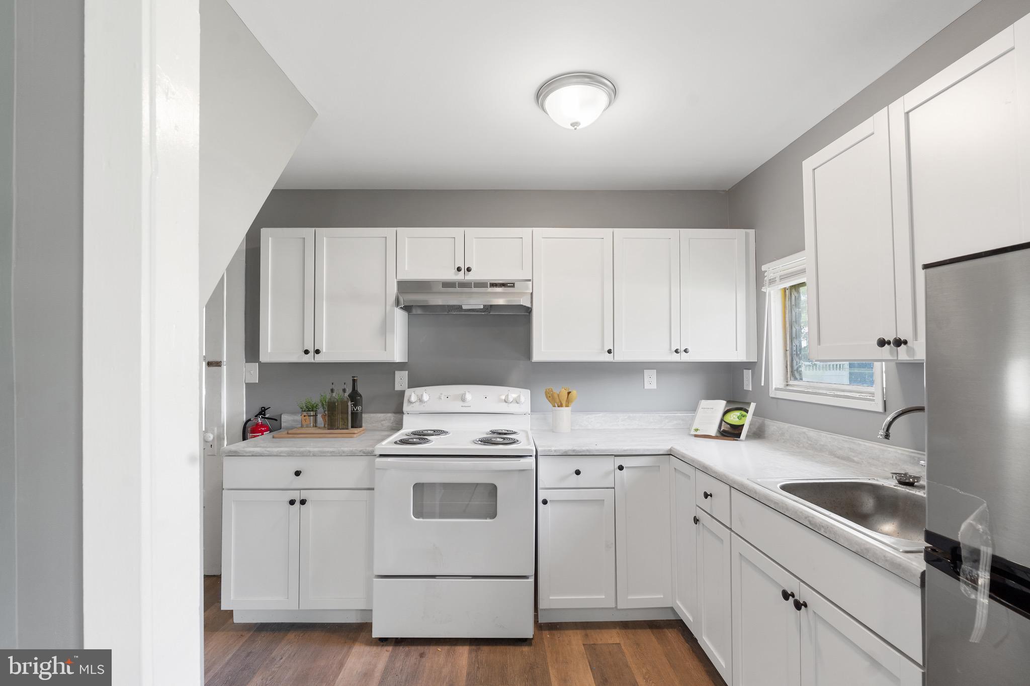 109 Georgia Road Pennsville, NJ 08070 - Photo 17 of 40 a kitchen with a sink cabinets and window