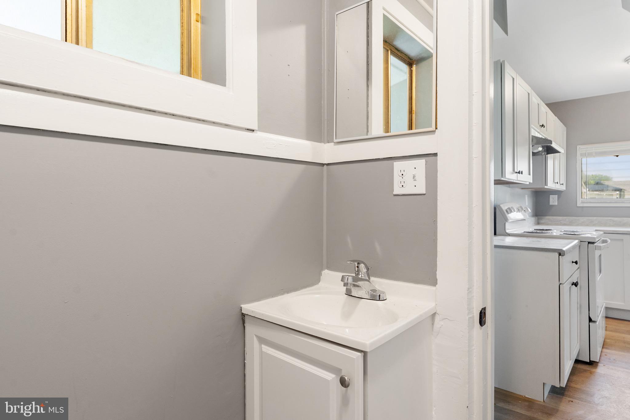 109 Georgia Road Pennsville, NJ 08070 - Photo 21 of 40 a bathroom with a sink and a mirror