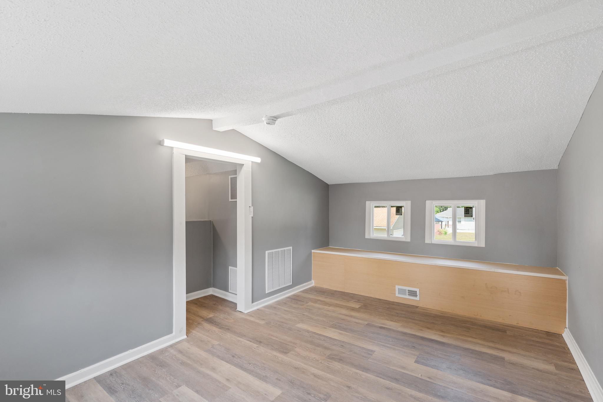 109 Georgia Road Pennsville, NJ 08070 - Photo 32 of 40 a view of wooden floor and windows in a room
