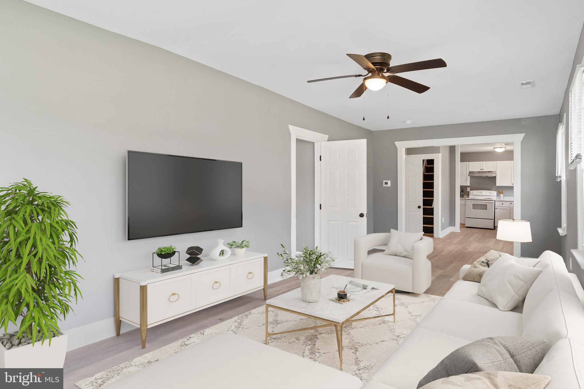109 Georgia Road Pennsville, NJ 08070 - Photo 5 of 40 a living room with furniture and a flat screen tv