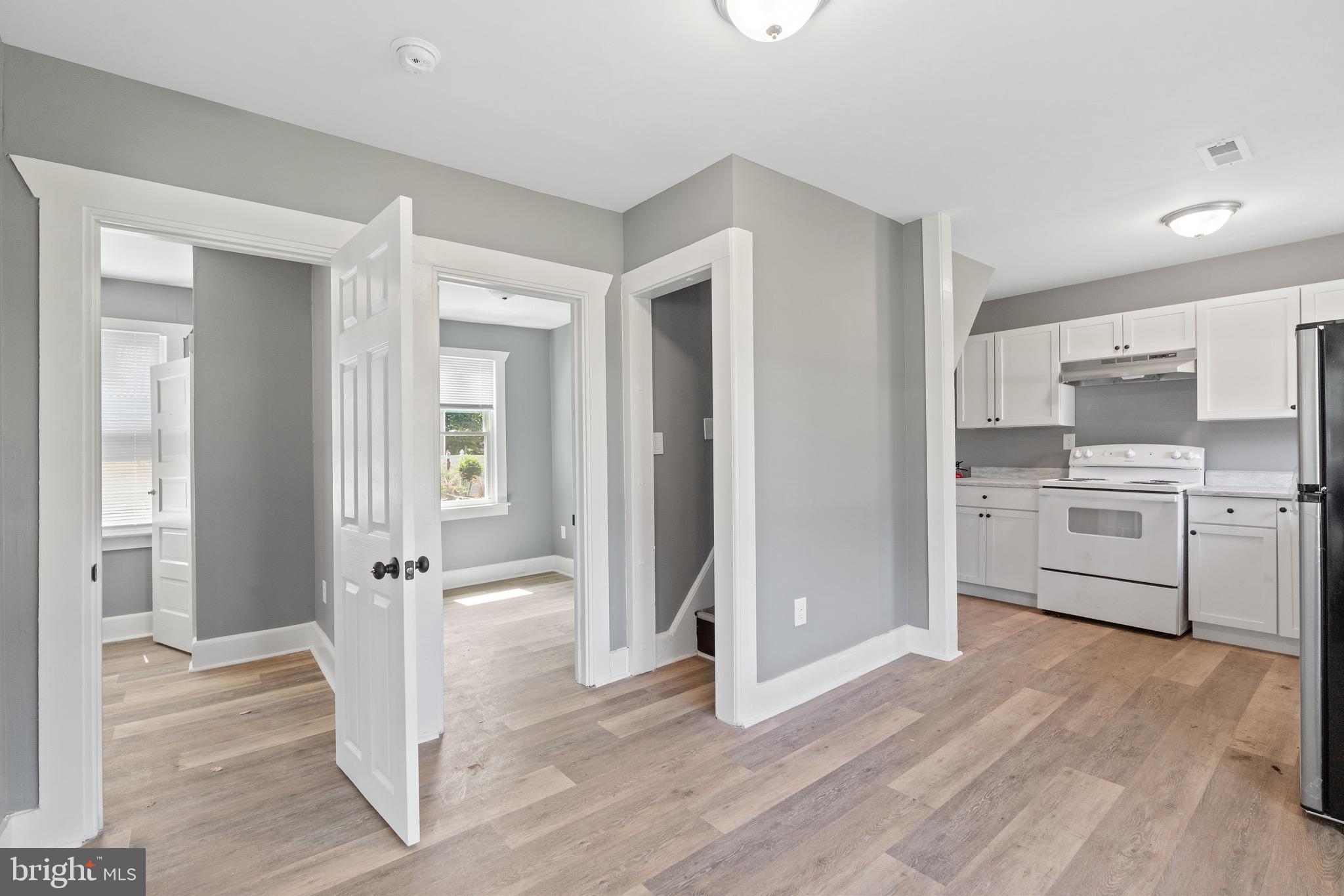 109 Georgia Road Pennsville, NJ 08070 - Photo 10 of 40 a view of a kitchen with a sink and a refrigerator
