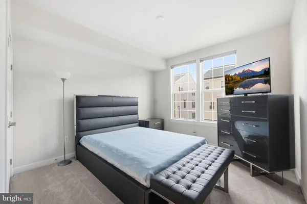 a bedroom with a bed and furniture