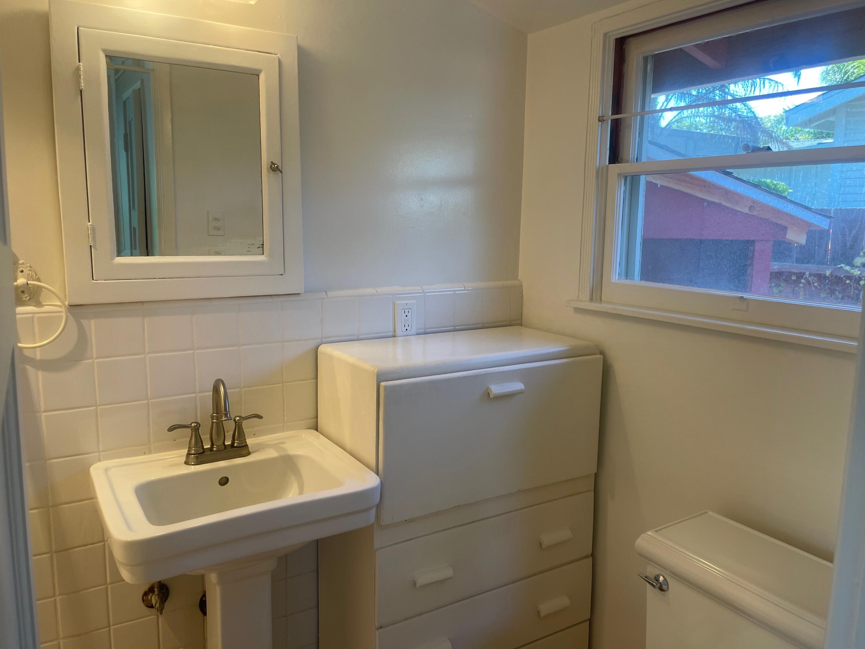 5161 6th Street Carpinteria, CA 93013 - Photo 12 of 27 a bathroom with a sink and a toilet