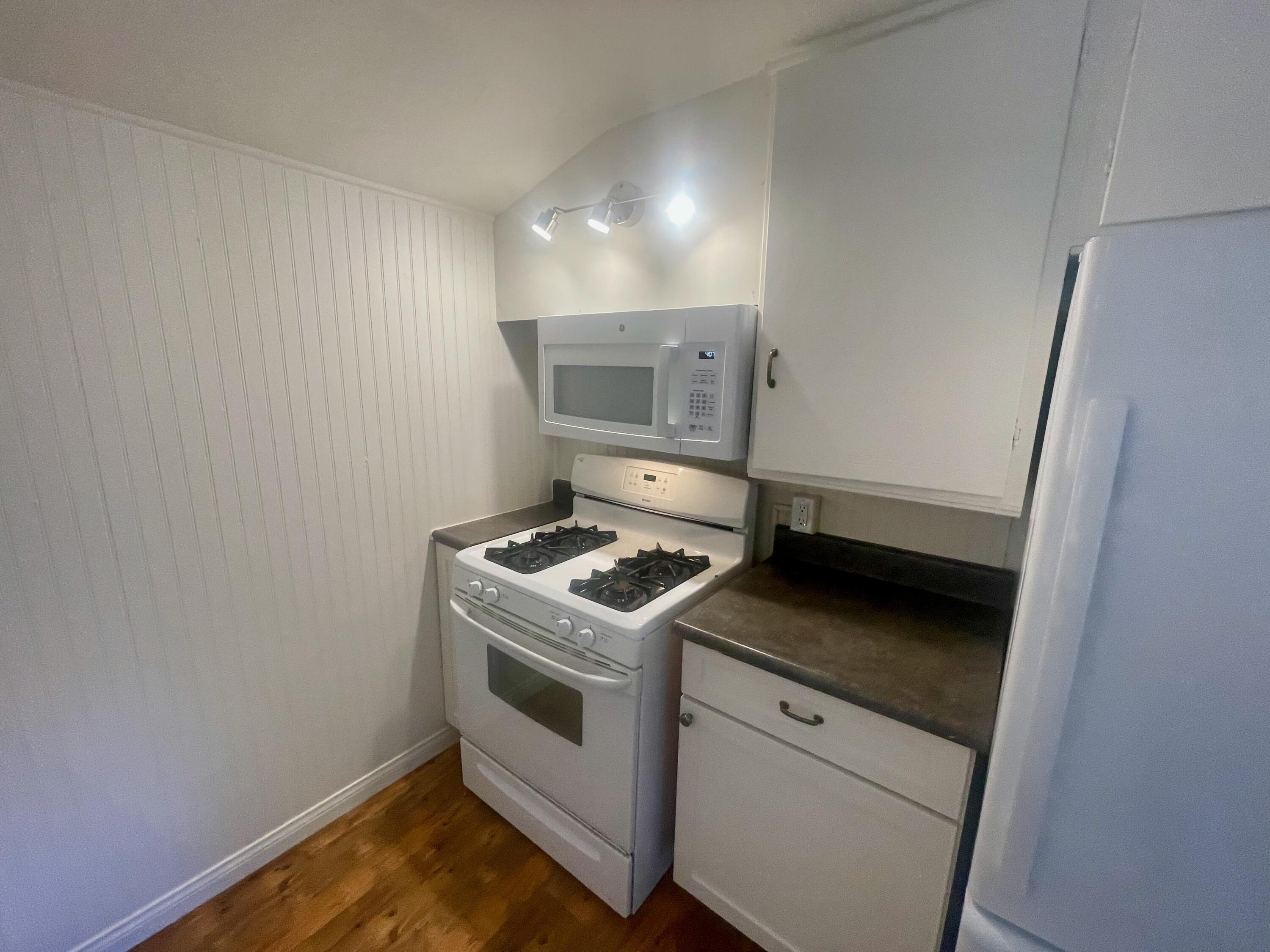 5161 6th Street Carpinteria, CA 93013 - Photo 6 of 27 a stove top oven sitting inside of a kitchen