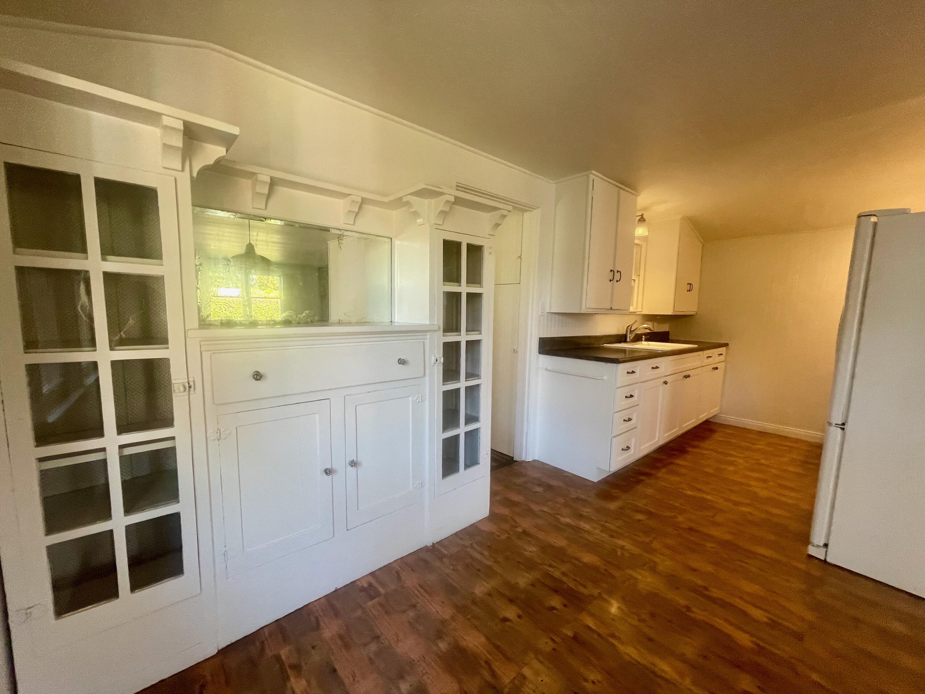 5161 6th Street Carpinteria, CA 93013 - Photo 7 of 27 a kitchen with stainless steel appliances granite countertop a stove and a refrigerator