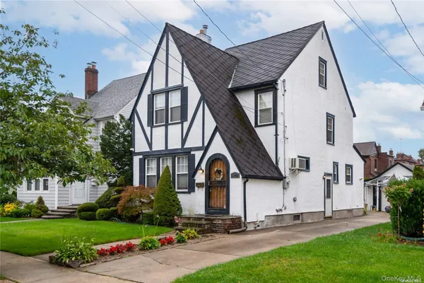a view of house with yard and entertaining space