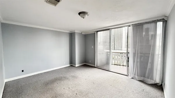 a view of an empty room with a window