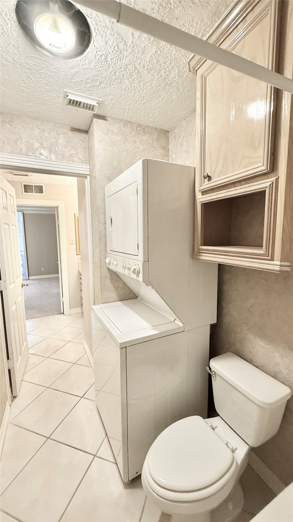 2016 Main Street, Unit 1113 Houston, TX 77002 - Photo 14 of 44 a bathroom with a sink a toilet a mirror and vanity