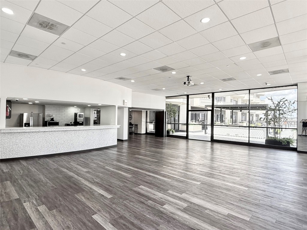 2016 Main Street, Unit 1113 Houston, TX 77002 - Photo 33 of 44 a view of an empty room with window and wooden floor
