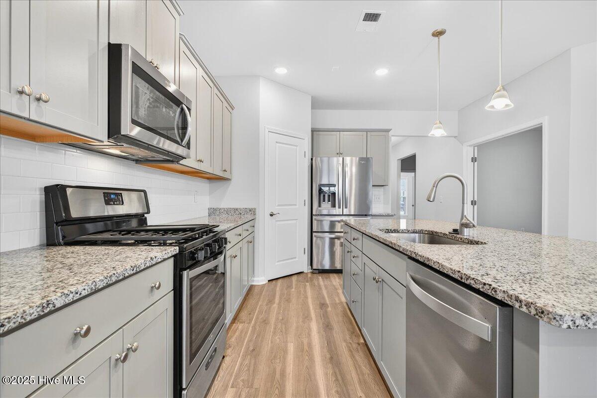 9355 Eagle Rdg Drive Calabash, NC 28467 - Photo 27 of 83 Kitchen area featuring stainless steel appliances.