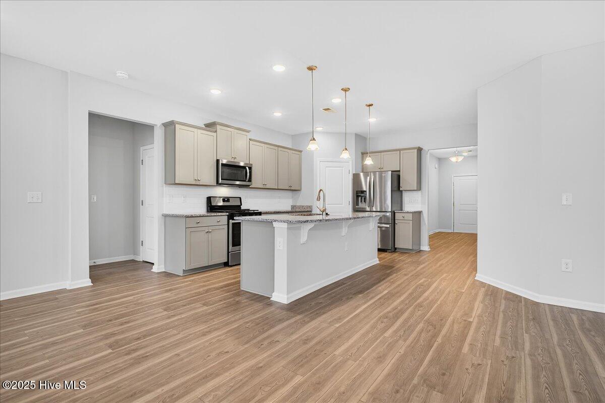 9355 Eagle Rdg Drive Calabash, NC 28467 - Photo 28 of 83 View into kitchen from living area.