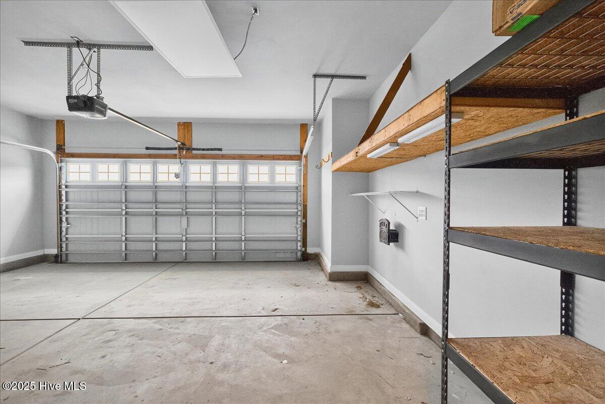 9355 Eagle Rdg Drive Calabash, NC 28467 - Photo 52 of 77 Large garage with shelving.