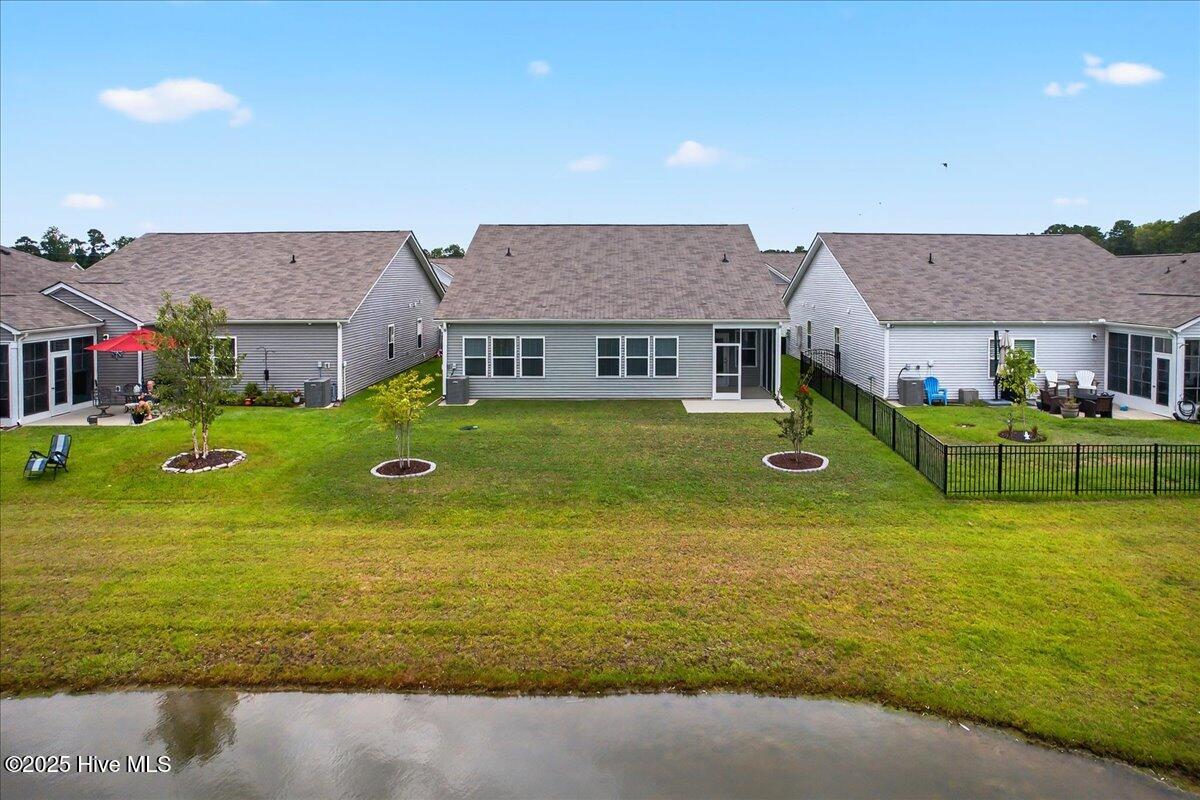 9355 Eagle Rdg Drive Calabash, NC 28467 - Photo 74 of 83 Back exterior of property with pond views.