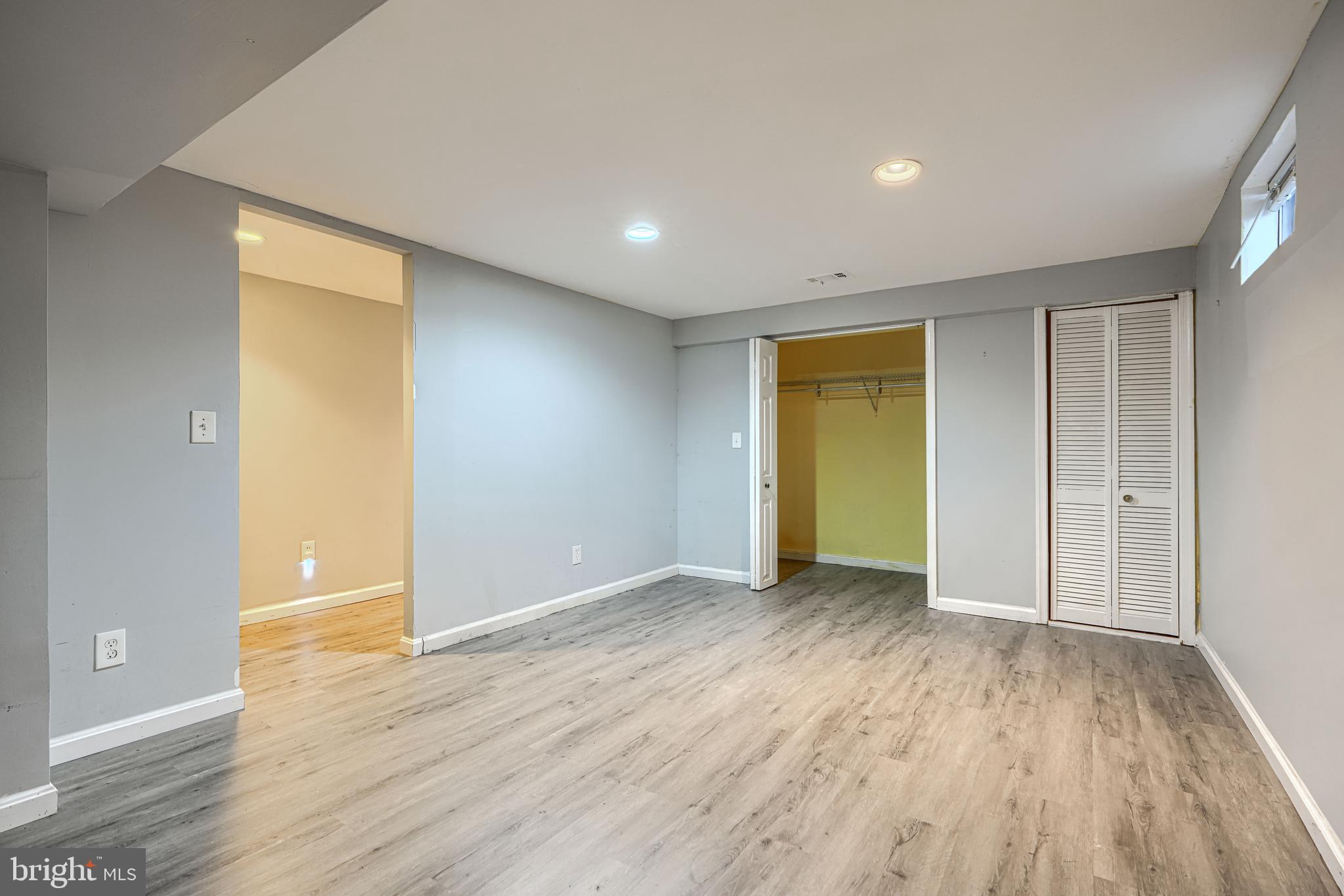 9706 Liberty Road Randallstown, MD 21133 - Photo 33 of 43 an empty room with wooden floor and closet
