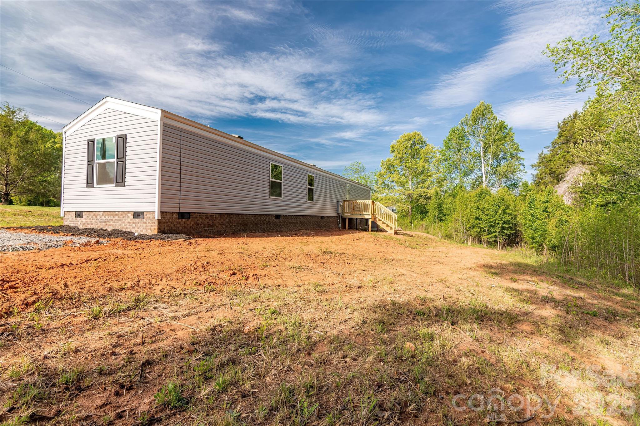 482 Jm Lovelace Road Ellenboro, NC 28040 - Photo 28 of 30 a view of a house with a yard