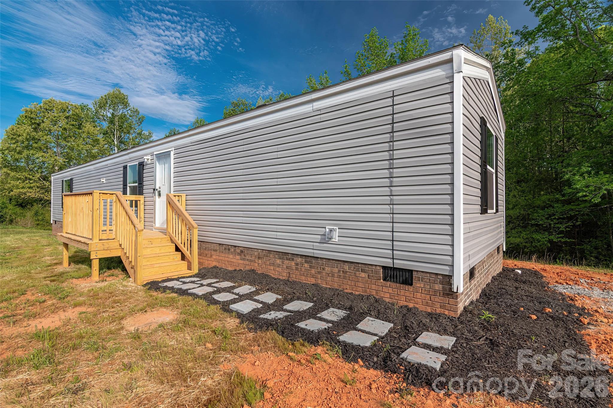 482 Jm Lovelace Road Ellenboro, NC 28040 - Photo 5 of 30 a view of a back yard of the house