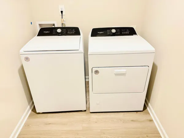 a utility room with dryer and washer