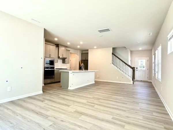 a view of kitchen with wooden floor
