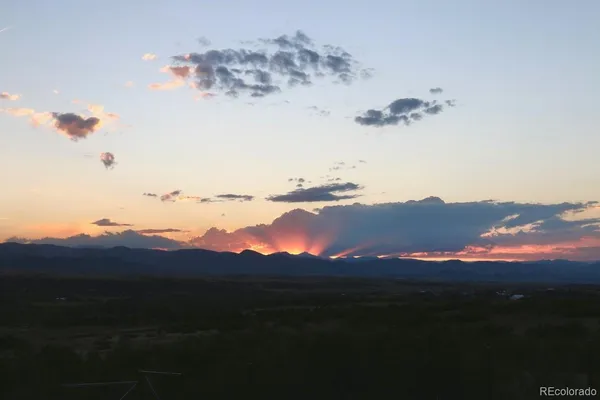a view of sunset and a mountain