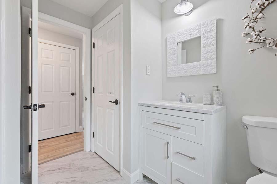 6 Stage Coach Road Centerville, MA 02632 - Photo 9 of 29 a bathroom with a sink a toilet and shower