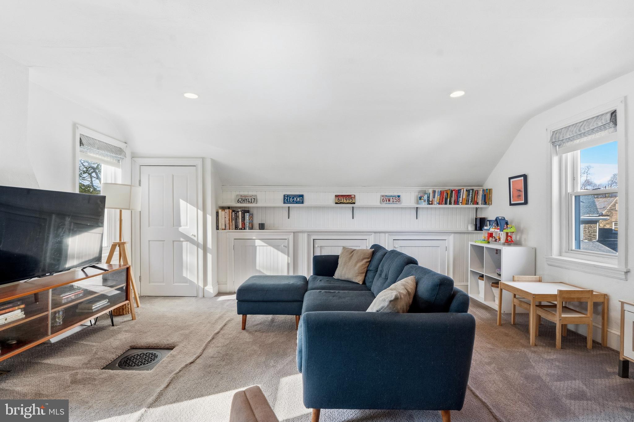 212 Benezet Street Philadelphia, PA 19118 - Photo 18 of 32 a living room with furniture and a flat screen tv