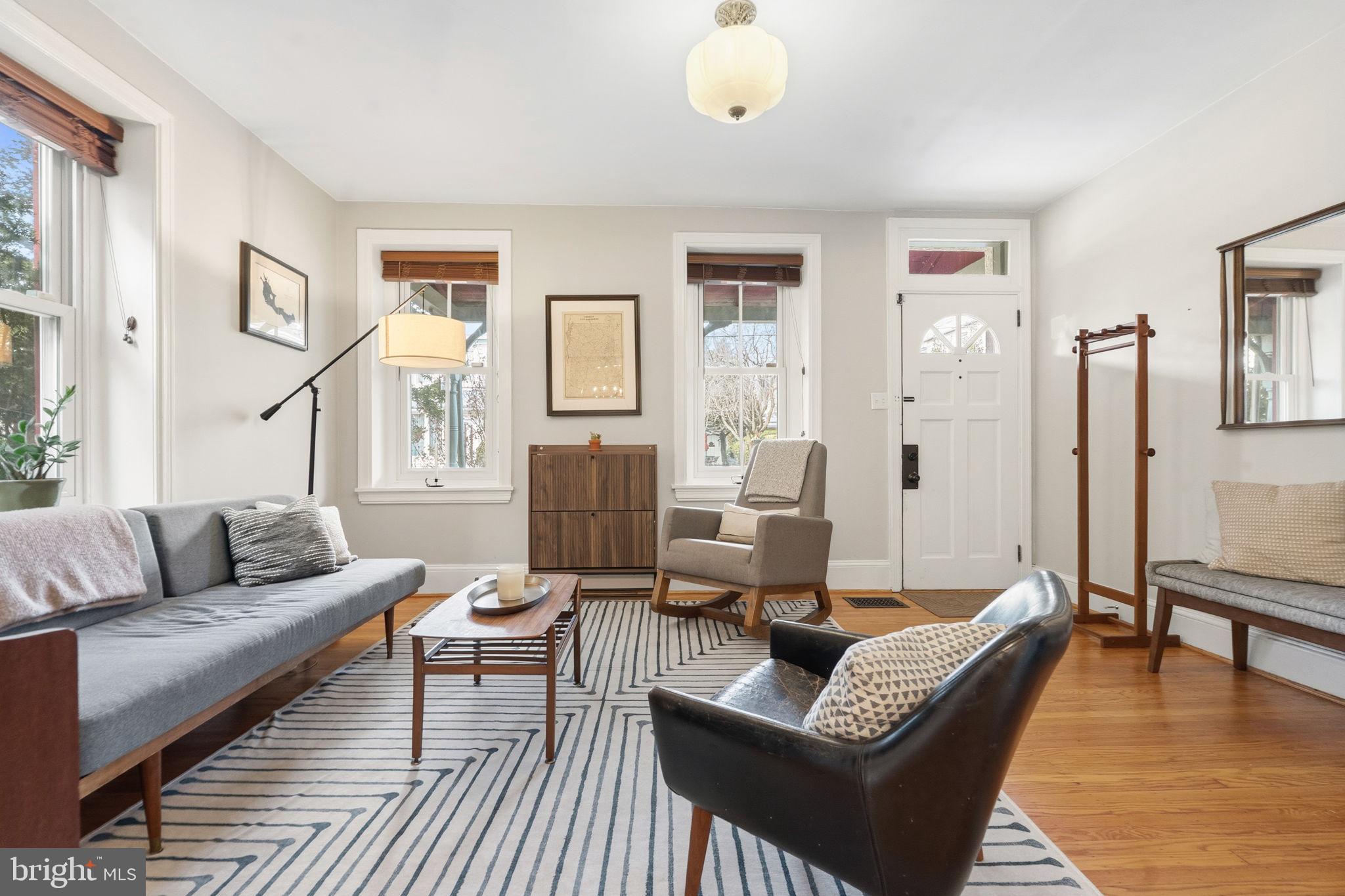 212 Benezet Street Philadelphia, PA 19118 - Photo 3 of 32 a living room with furniture and a table