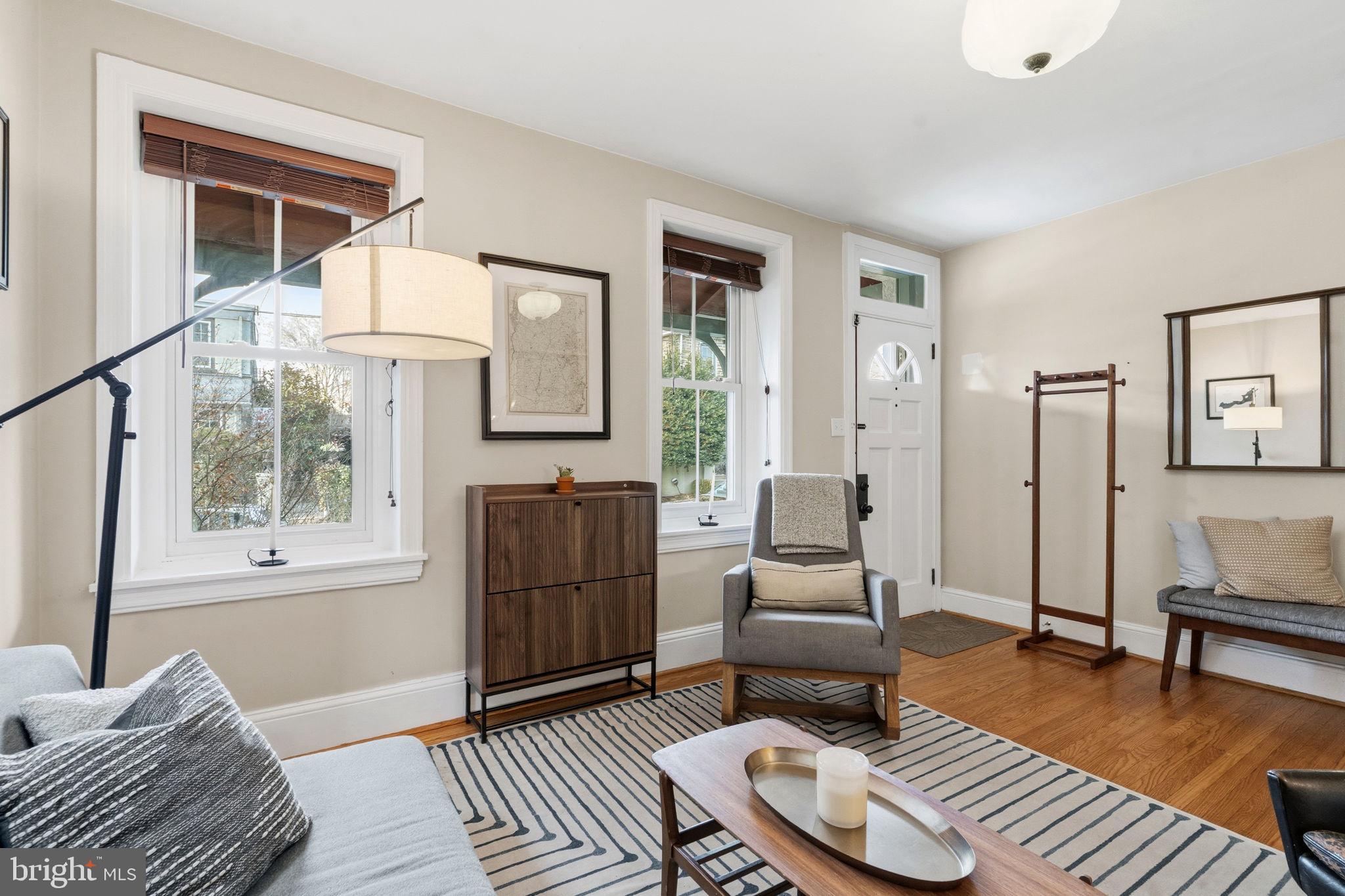 212 Benezet Street Philadelphia, PA 19118 - Photo 4 of 32 a living room with furniture a rug and a window