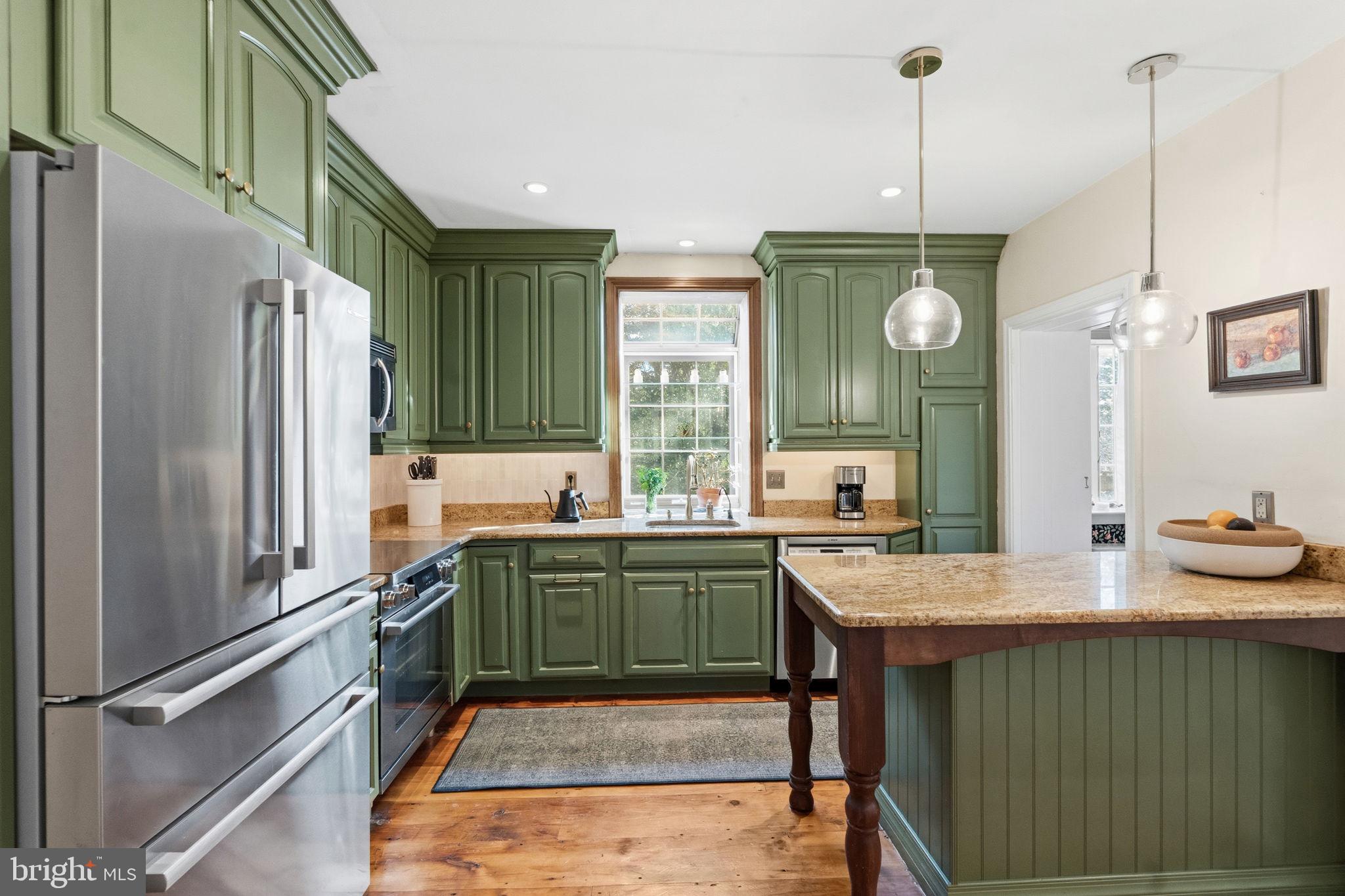 212 Benezet Street Philadelphia, PA 19118 - Photo 10 of 32 a kitchen with sink cabinets and window