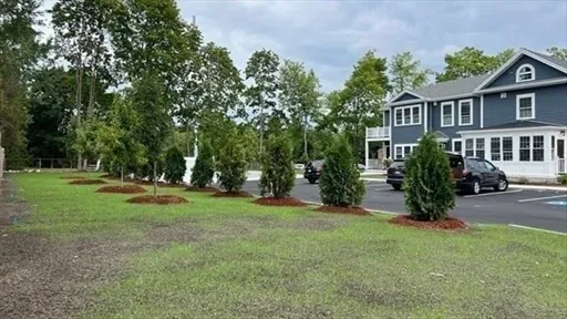 a view of a house with backyard