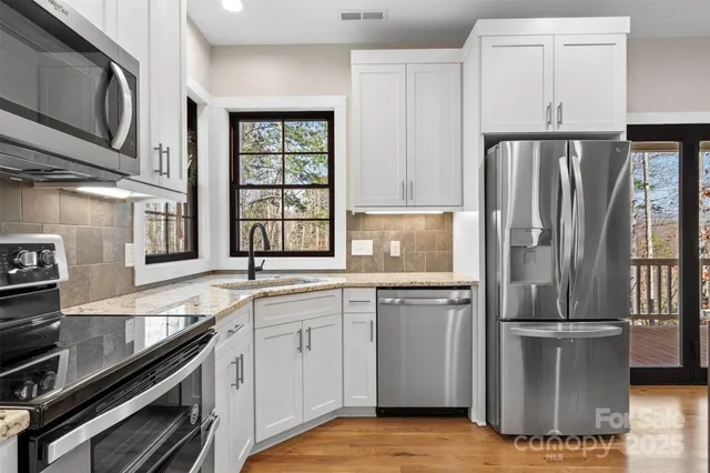 a view of a room with rack on the wall and a window