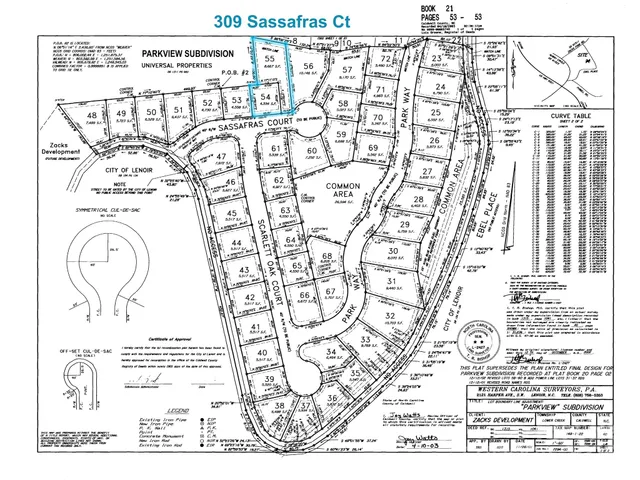 a kitchen with stainless steel appliances kitchen island granite countertop a stove a sink and a refrigerator