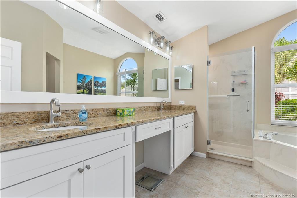 12813 Northwest Cinnamon Way Palm City, FL 34990 - Photo 16 of 33 a bathroom with a granite countertop sink mirror and a
