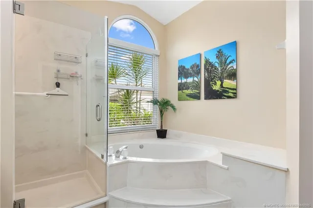 a bathroom with a bathtub and a shower
