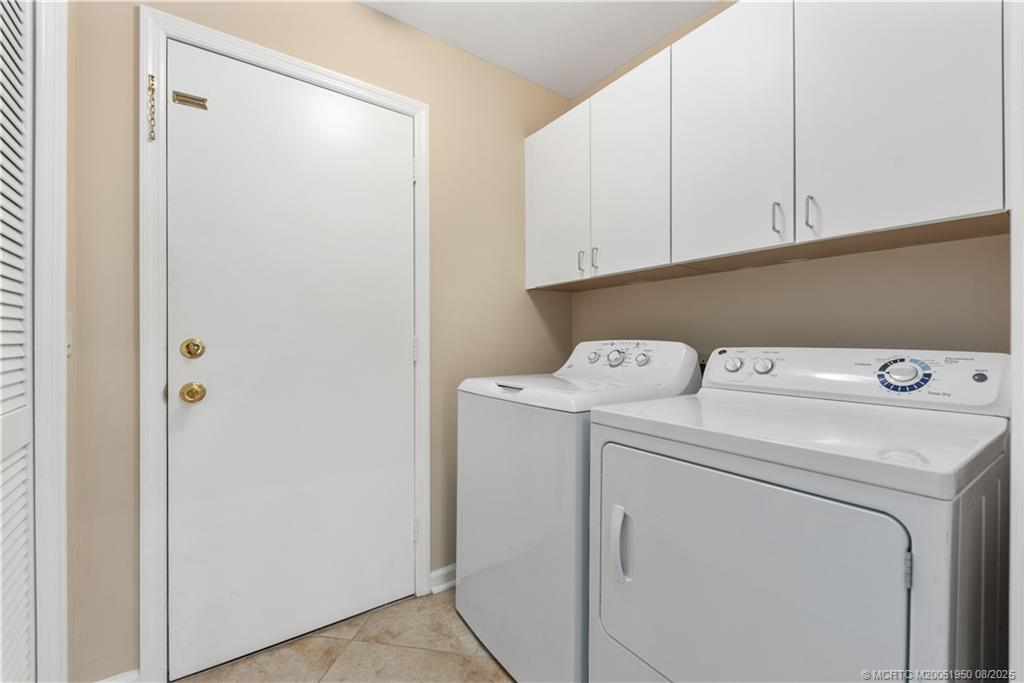 12813 Northwest Cinnamon Way Palm City, FL 34990 - Photo 21 of 33 a utility room with dryer and washer