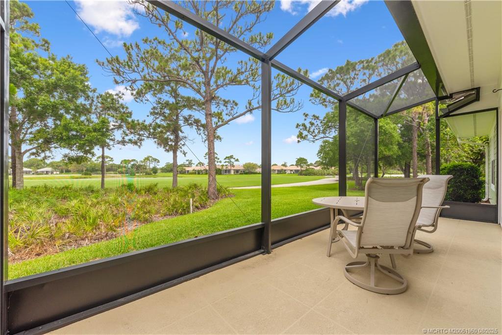 12813 Northwest Cinnamon Way Palm City, FL 34990 - Photo 23 of 33 a view of a two chairs in the deck next to a yard