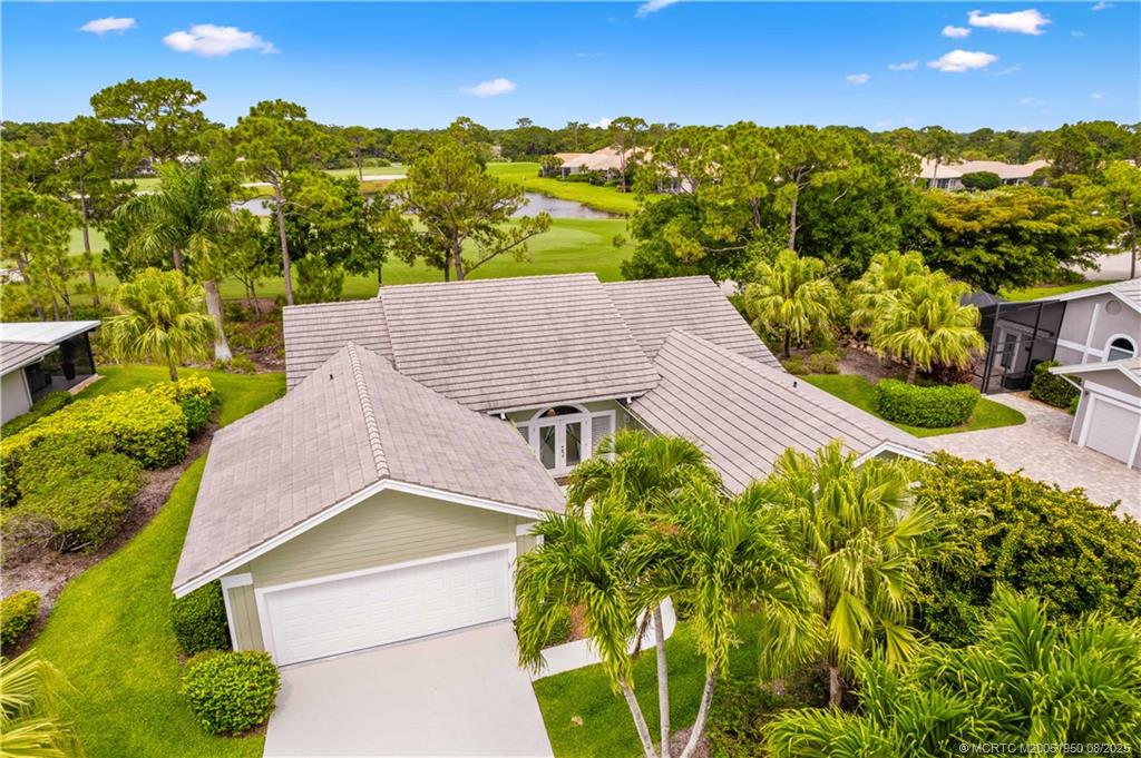 12813 Northwest Cinnamon Way Palm City, FL 34990 - Photo 24 of 33 a view of houses with yard