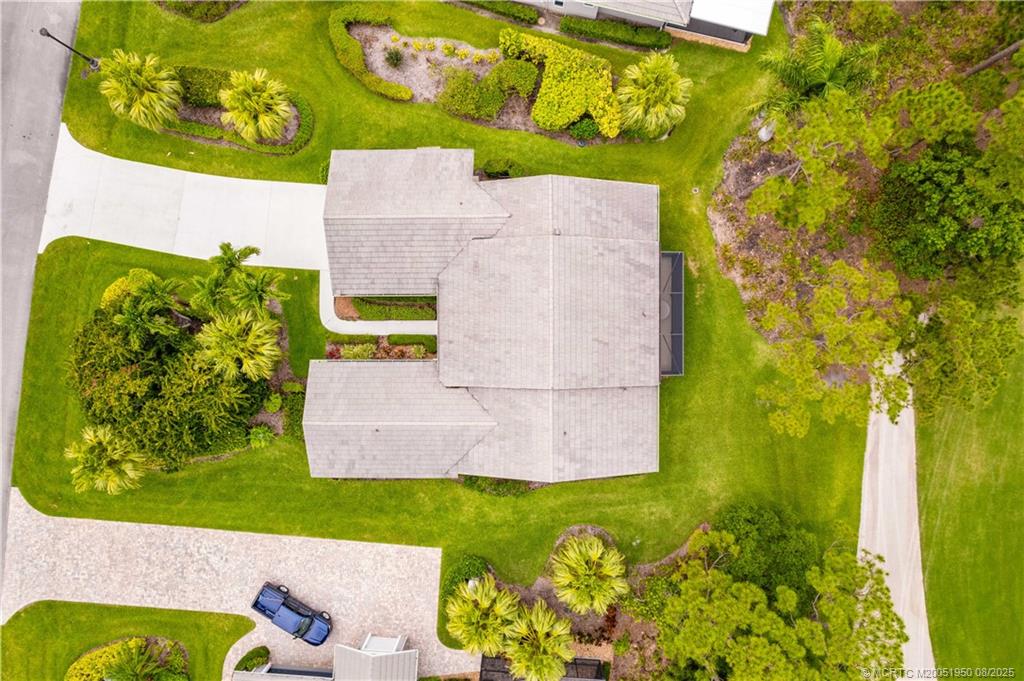 12813 Northwest Cinnamon Way Palm City, FL 34990 - Photo 26 of 33 view of a house with a yard