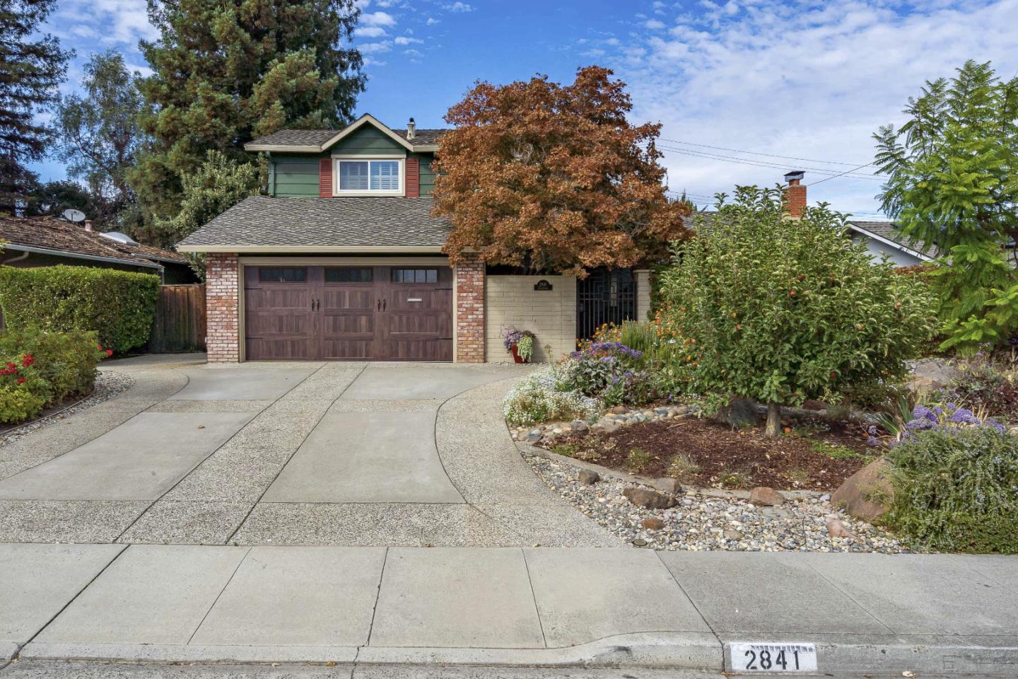 2841 Pruneridge Avenue Santa Clara, CA 95051 - Photo 2 of 53 a front view of a house with a yard and garage